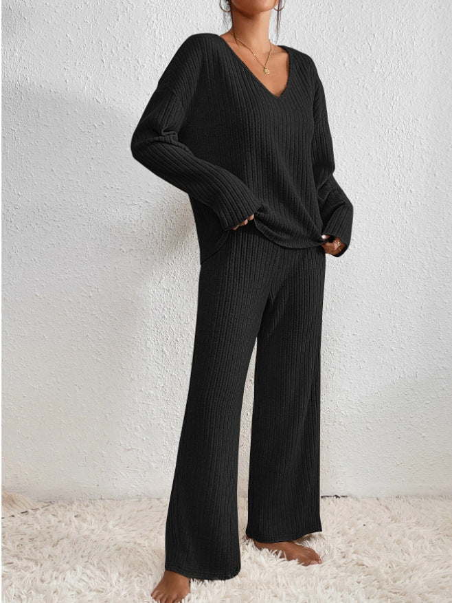 Casual women's comfort wear: ribbed knit V-neck top and wide-leg lounge pants set.