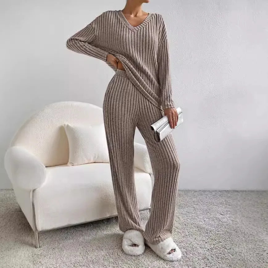 Elegant yet cozy women's ribbed knit lounge set. Features a V-neck top & wide-leg pants for ultimate comfort.