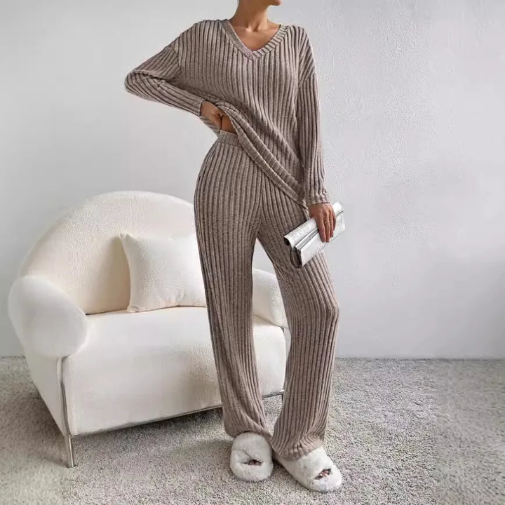 Elegant yet cozy women's ribbed knit lounge set. Features a V-neck top & wide-leg pants for ultimate comfort.