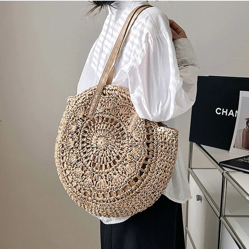 Women's round woven beach tote. Bohemian style straw bag for summer & vacation. Natural texture.