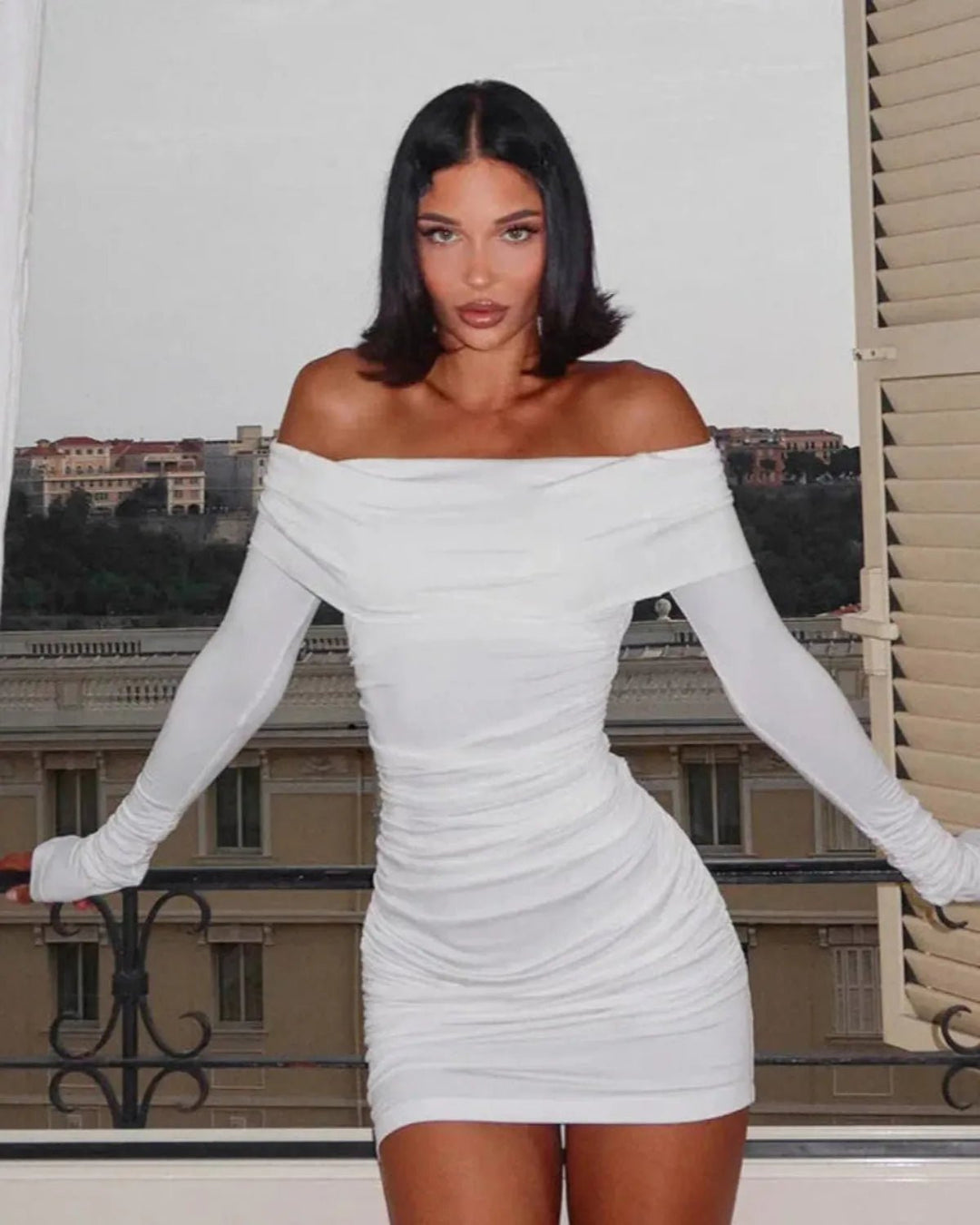 Elegant women's ruched mini dress with an asymmetrical off-shoulder design, offering a flattering bodycon fit for parties.
