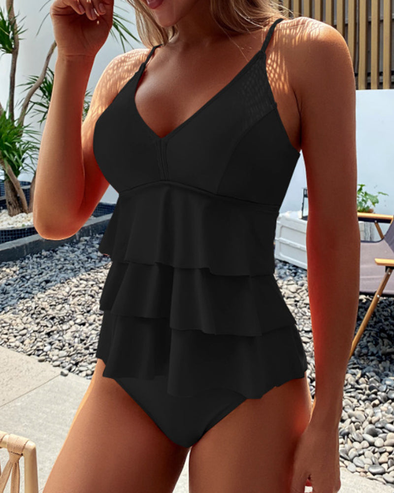 Close-up of women's layered ruffle tankini top with adjustable straps, great for pool parties.