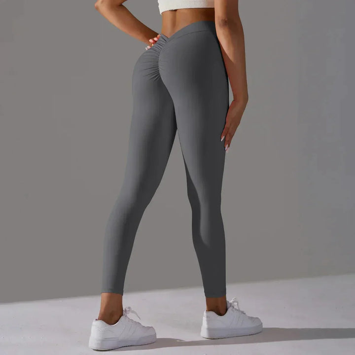 Women's scrunch butt compression leggings showcasing flattering fit for yoga & gym.