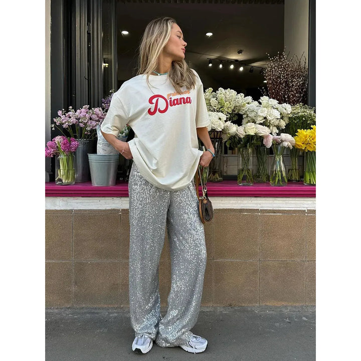 High-waist women's sequin trousers with a wide leg. Shimmering glitter pants for parties, festive & evening wear.