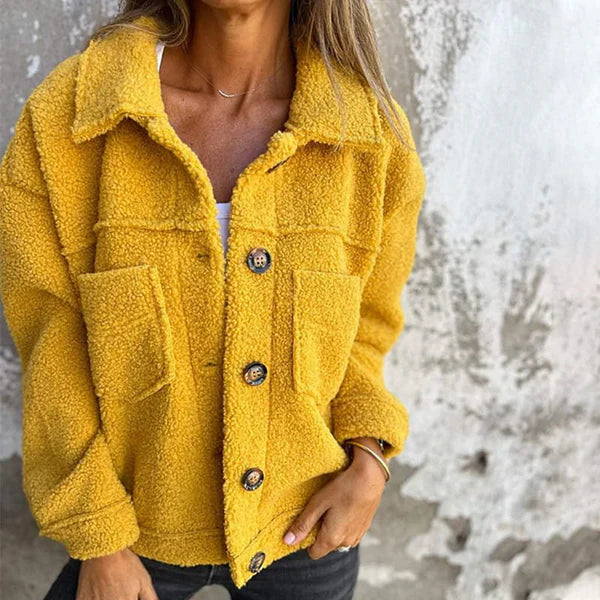 Women's short teddy coat with stylish lapel collar, warm & cozy for autumn/winter fashion.