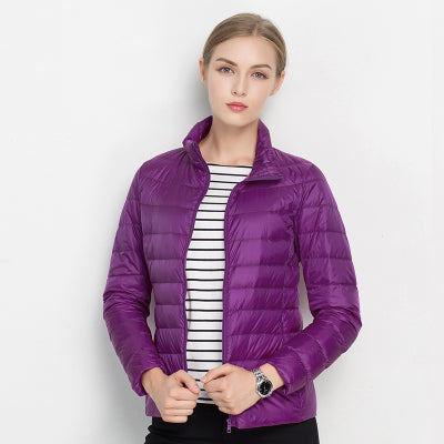 Comfortable women's quilted puffer jacket, lightweight and warm with a sleek design and protective stand collar.
