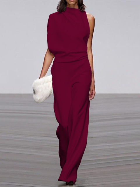 Full length image of women's elegant sleeveless open-back wide-leg jumpsuit, a perfect summer one-piece.