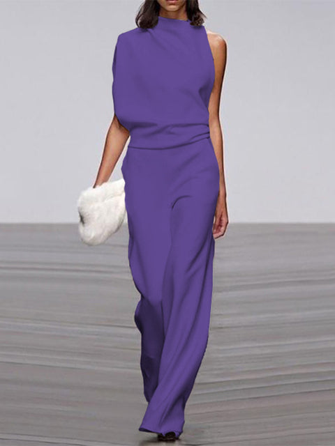 Flowing wide-leg women's jumpsuit, sleeveless and open-back, offering elegant movement and comfort.