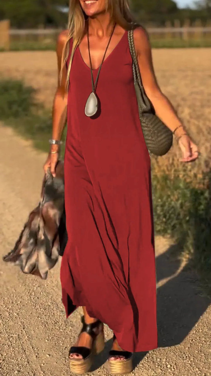 Woman enjoying her vacation in a comfortable sleeveless summer maxi dress for resort style.