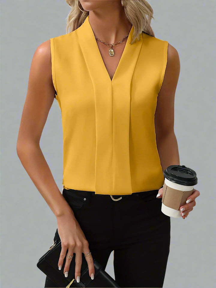 Chic women's sleeveless V-neck blouse, ideal for comfortable summer fashion, daily wear & smart casual looks.