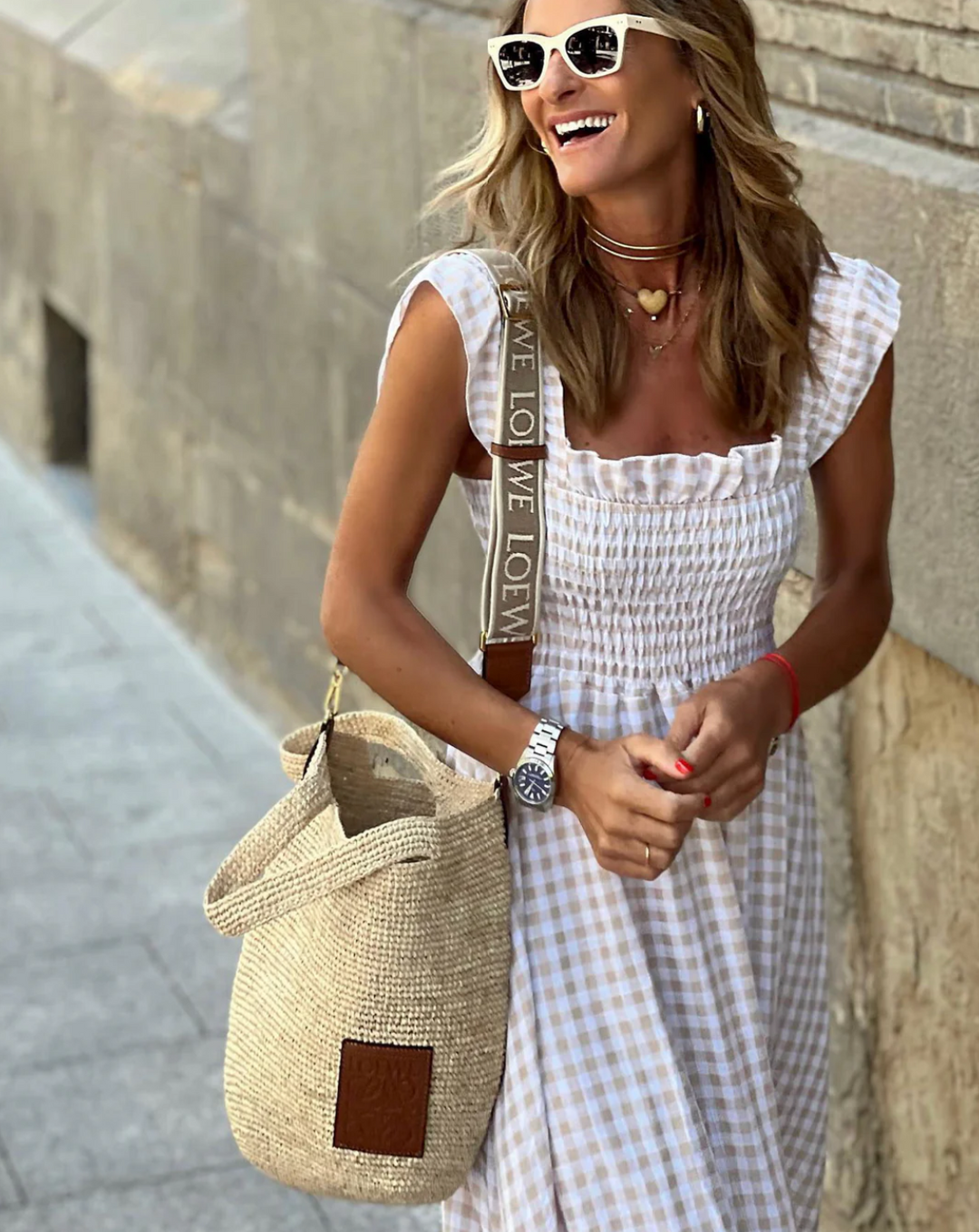 Comfortable women's smocked gingham maxi dress with charming ruffle sleeves, a versatile long summer dress.