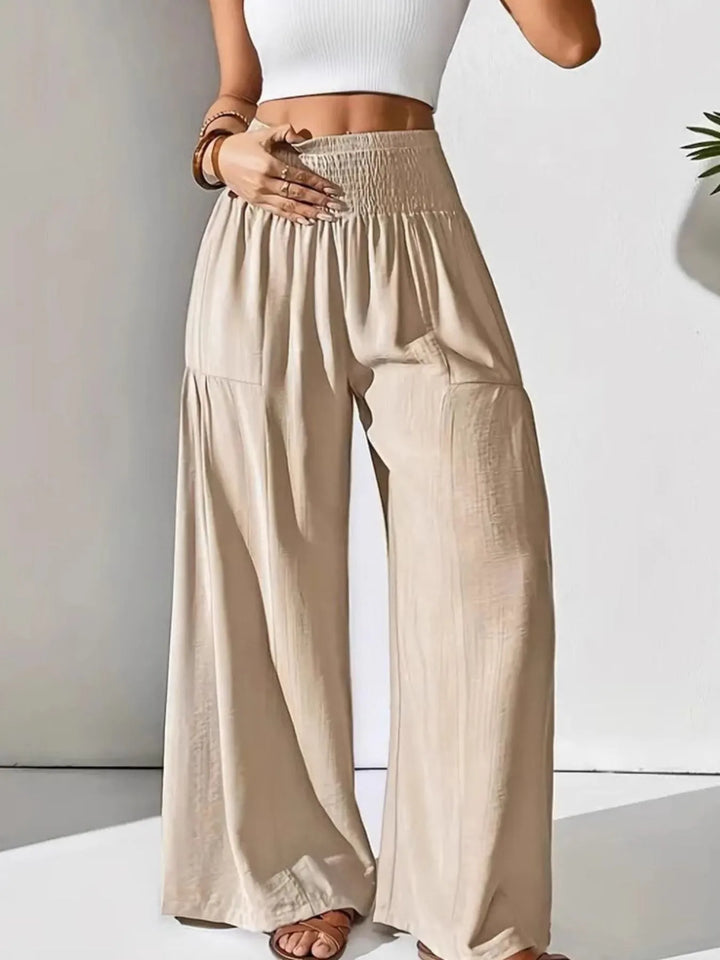 Stylish high waist smocked wide leg pants for women, versatile for casual, comfort, and travel wear.