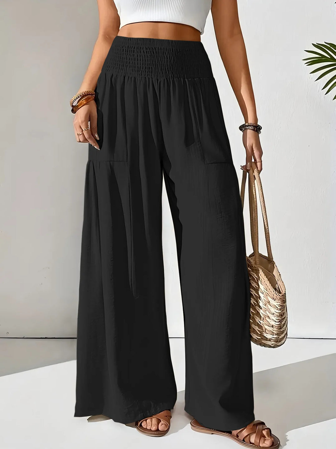 Casual women's wide leg pants with smocked waist, a must-have for summer fashion, comfort & travel.