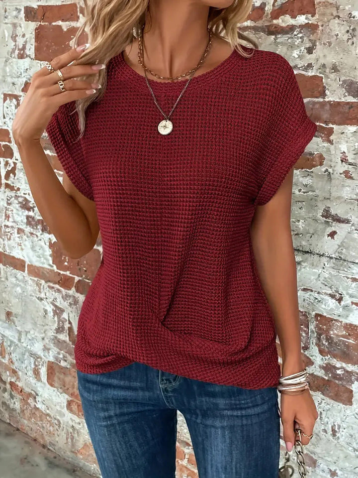 Relaxed fit women's textured waffle knit top, versatile for casual everyday styling.