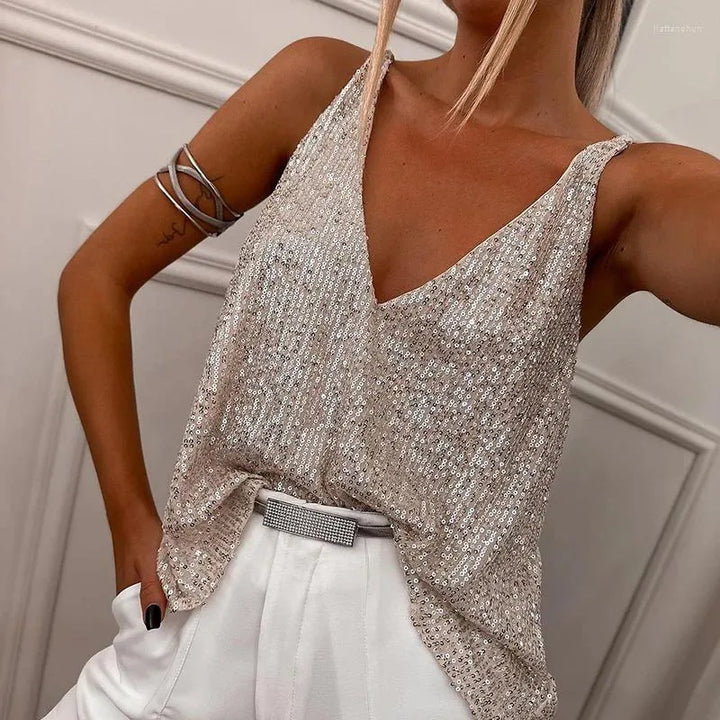 Beige sequin spaghetti strap top for women. Sparkling sleeveless design, perfect for glamorous parties & evening wear.