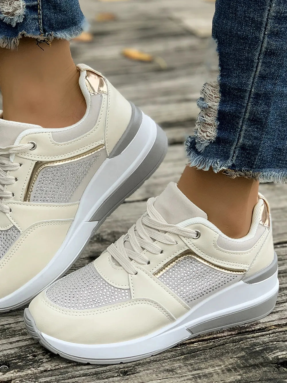 Trendy women's fashion sneakers, featuring sparkling platforms, rhinestone details, and a comfy round toe.