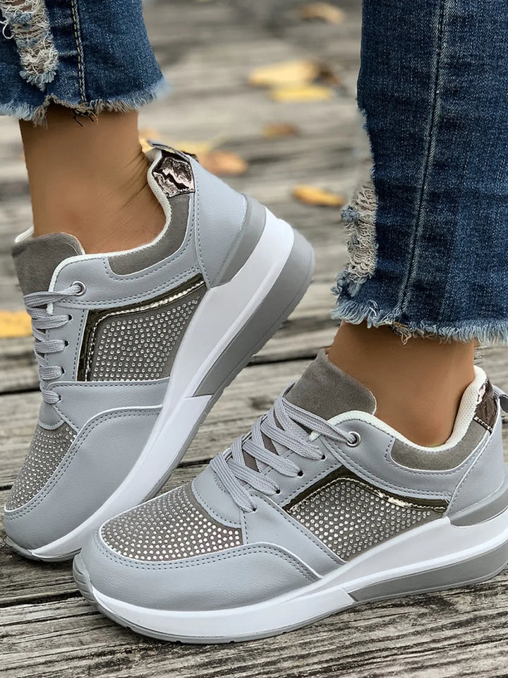 Women's comfortable sparkling platform sneakers, featuring shimmering rhinestones, lace-up closure & a trendy design.