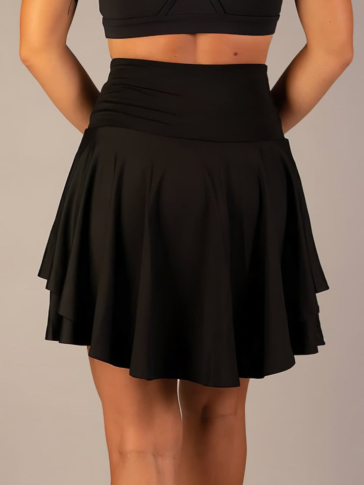 Performance women's tennis skirt with integrated shorts, ideal for fitness, training & active lifestyles.