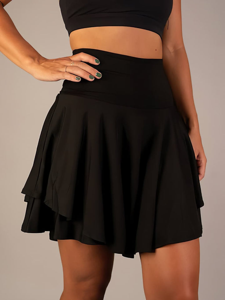 Tennis-ready women's athletic skirt with shorts & pockets, designed for comfort, movement & performance.