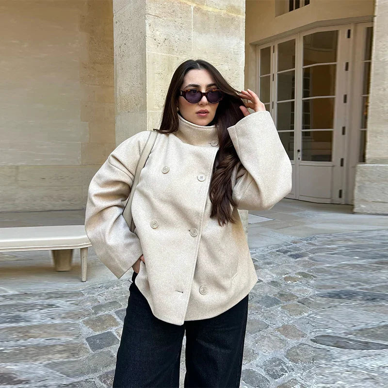 Women's classic pea coat with a stand collar, elegant and warm winter fashion.