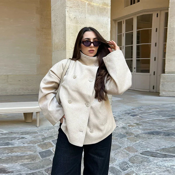 Women's classic pea coat with a stand collar, elegant and warm winter fashion.