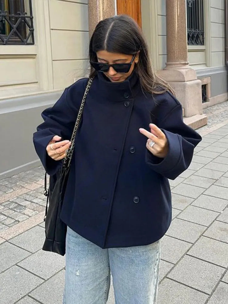 Fashionable women's pea coat with a stand collar, a classic winter jacket.