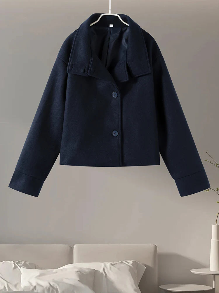 Timeless women's stand collar pea coat, elegant outerwear for fall and winter seasons.
