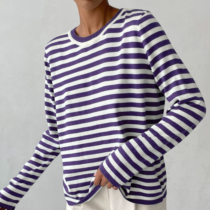 Stylish women's striped knit long sleeve crewneck sweater, offering a relaxed fit for versatile everyday wear.