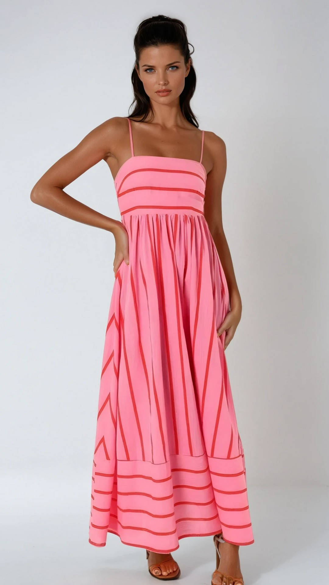 Women's striped strappy maxi dress, ideal for summer beach days & vacation wear.