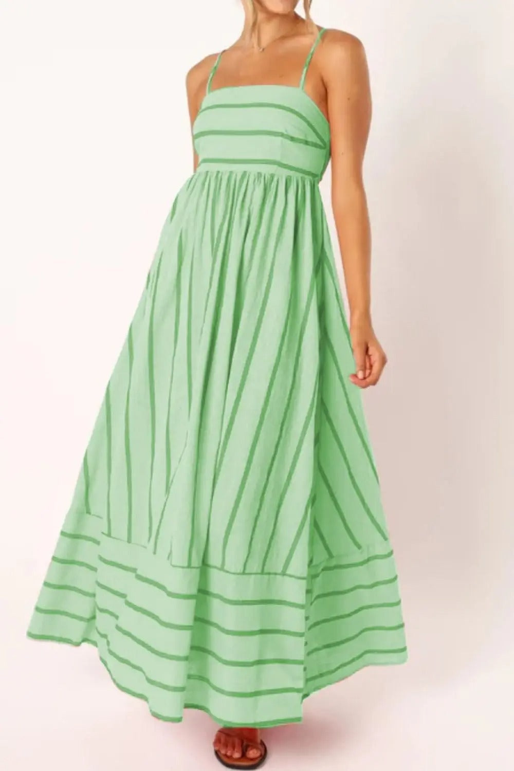 Flowy striped women's maxi dress, a stylish strappy beach dress for vacation.