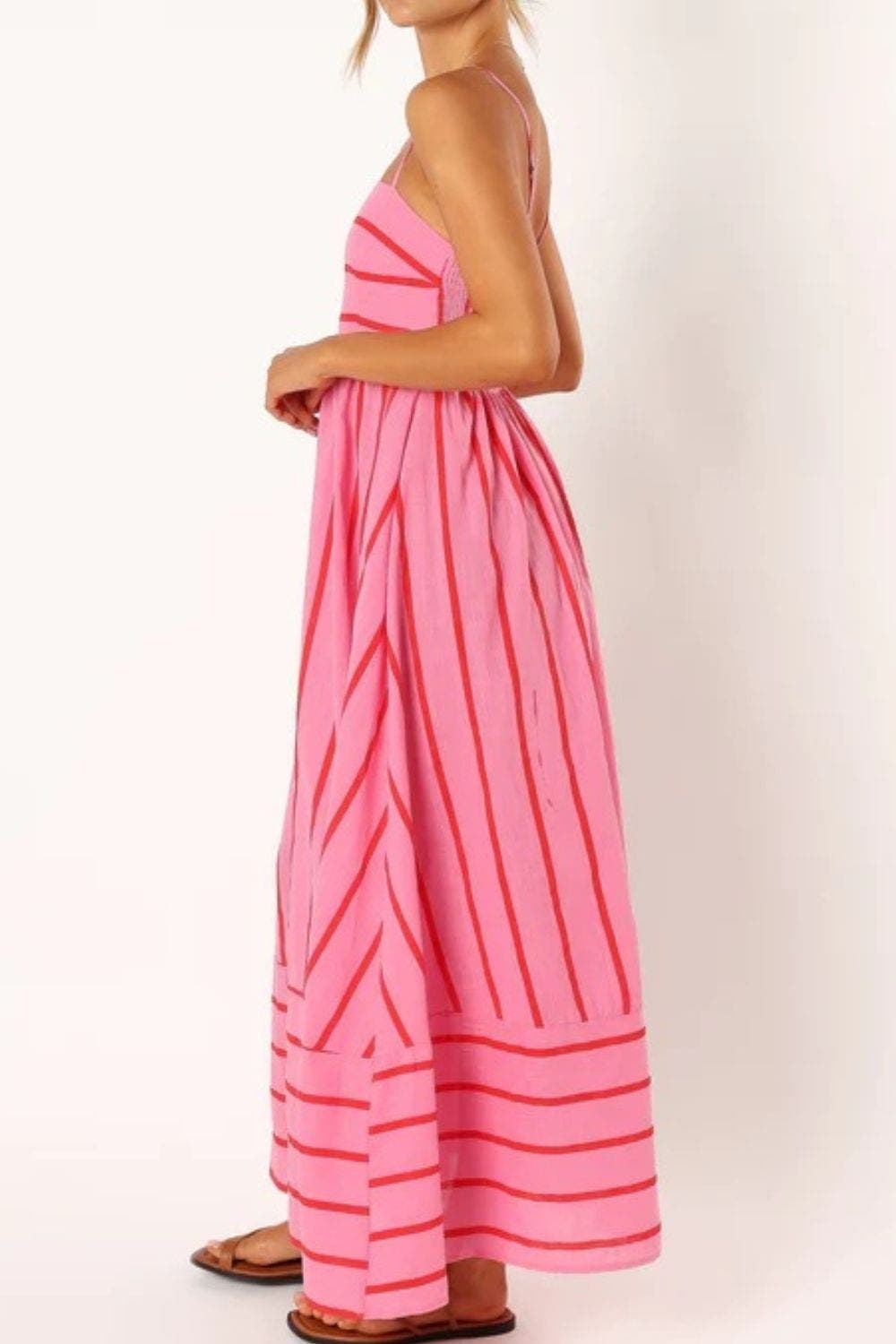 Stylish striped strappy maxi dress for women, ideal summer casual or elegant wear.