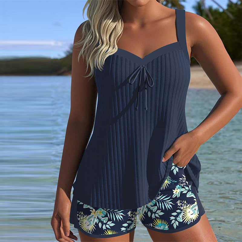 Women's striped tankini swimsuit with matching beach shorts, perfect for summer vacation.