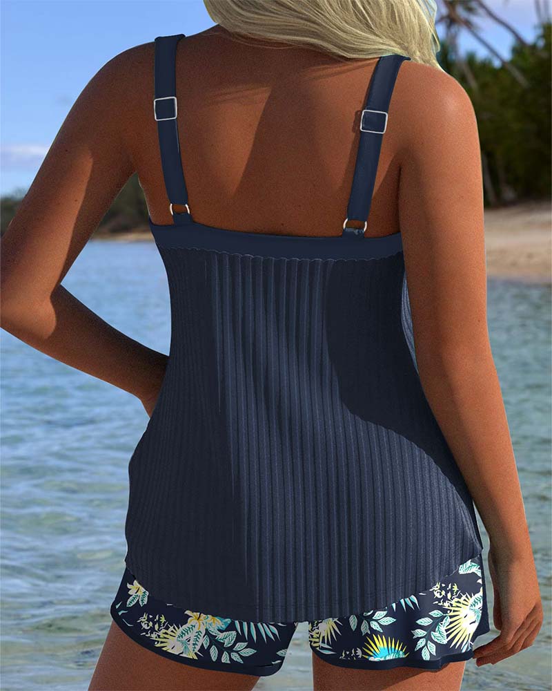 Modest two-piece striped tankini and shorts set for women, ideal for beach or pool wear.