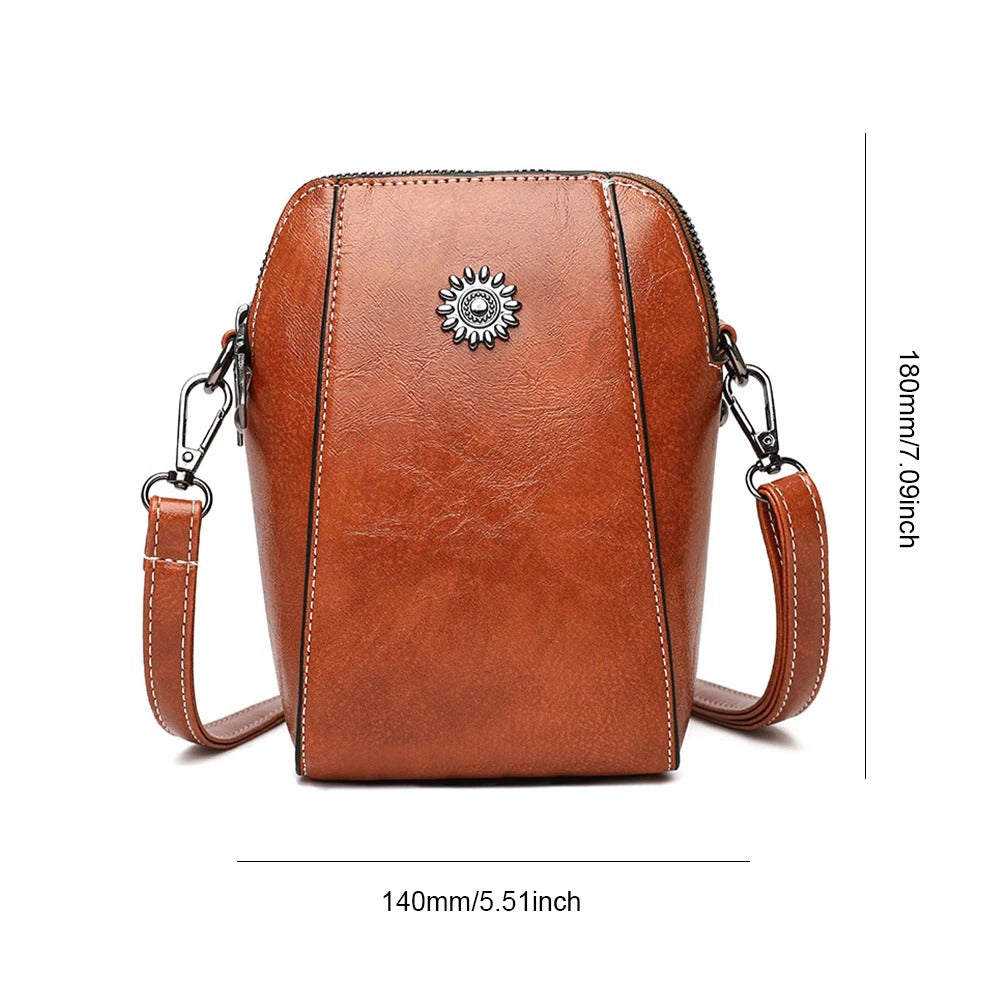 Versatile women's red leather shoulder bag, a stylish and functional everyday accessory with adjustable strap.