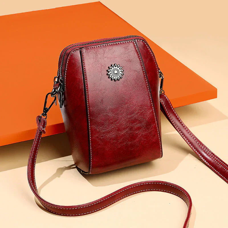 Classic brown leather shoulder bag for women, perfect for daily wear, featuring an adjustable strap.