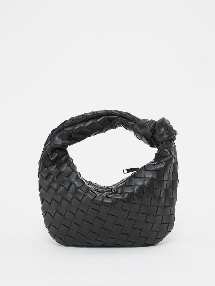 Textured braided shoulder bag for women with unique knot handle. Chic handbag.