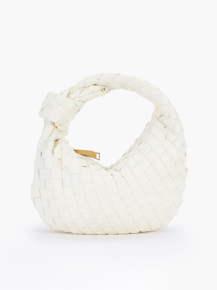 Modern women's shoulder bag: braided design, unique knot handle. Perfect versatile accessory.