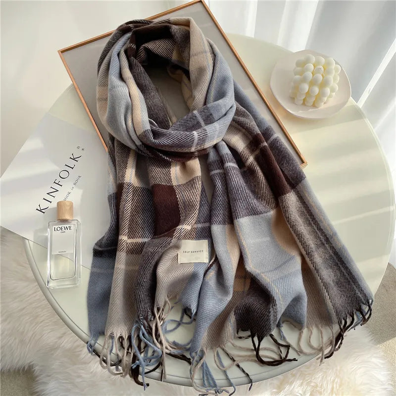 Soft Angela knitted cashmere scarf with chic checkered pattern for trendy women's winter style.