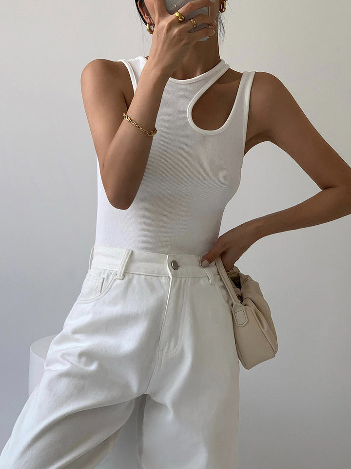 Stylish women's cutout tank top featuring an asymmetrical design, great for casual or chic summer wear.
