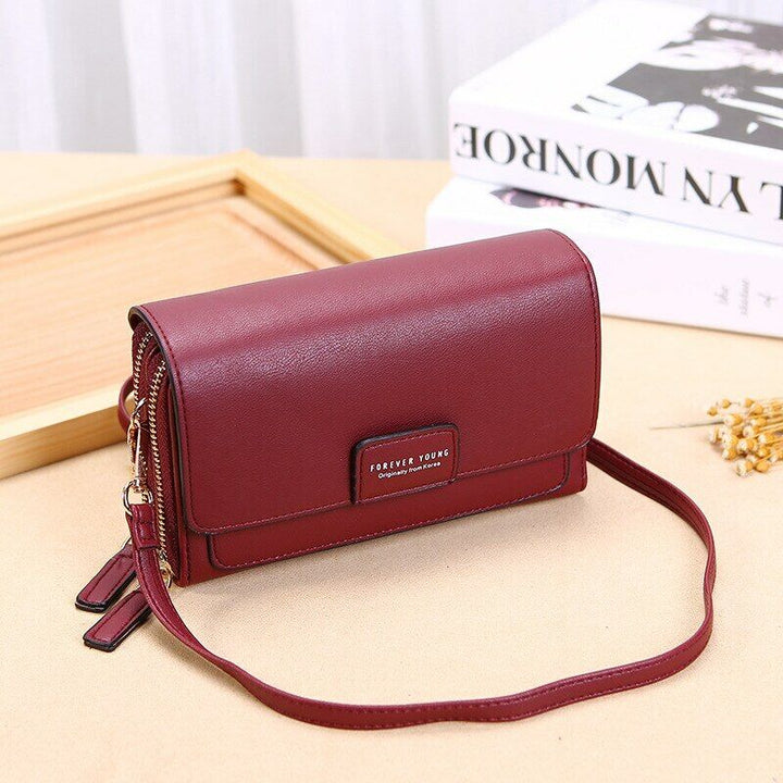 Everyday faux leather bag for women, a compact and stylish crossbody with a wallet.