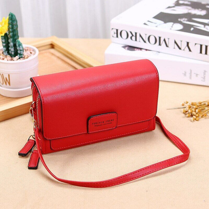 Sleek faux leather crossbody bag & compact wallet, perfect for women's travel needs.