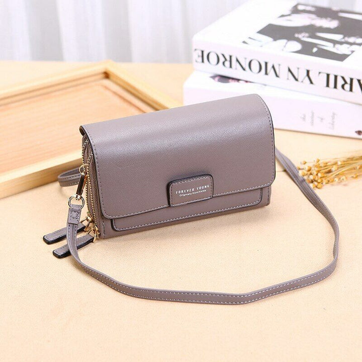 Practical women's faux leather bag, an organizational crossbody with an elegant wallet.