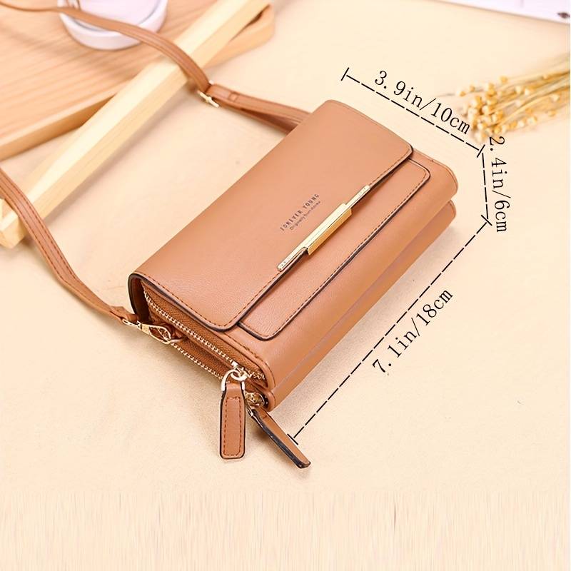 Compact women's faux leather crossbody bag, offering secure storage and an integrated wallet.