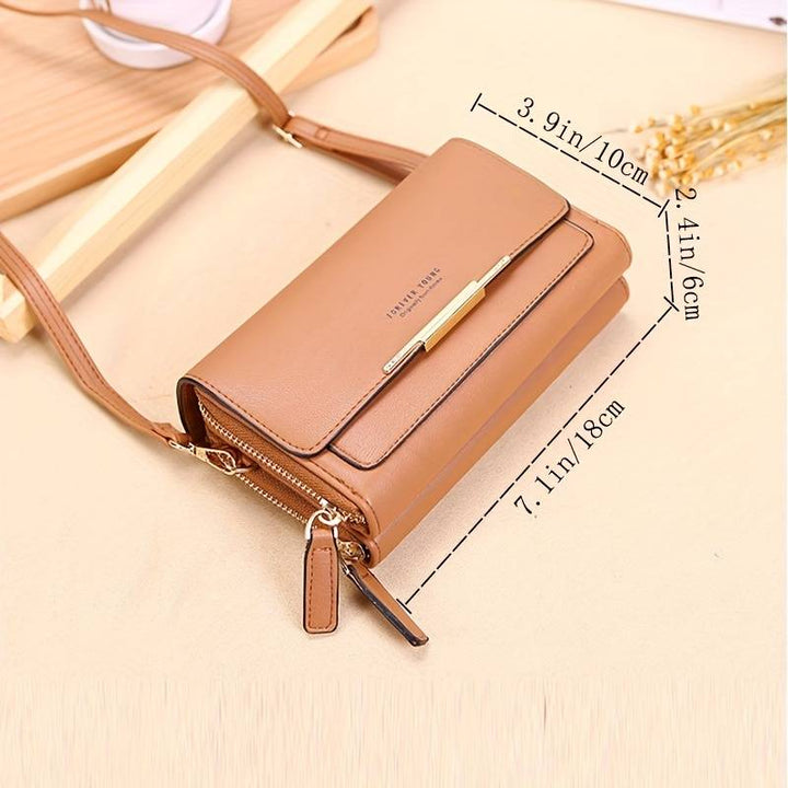 Compact women's faux leather crossbody bag, offering secure storage and an integrated wallet.