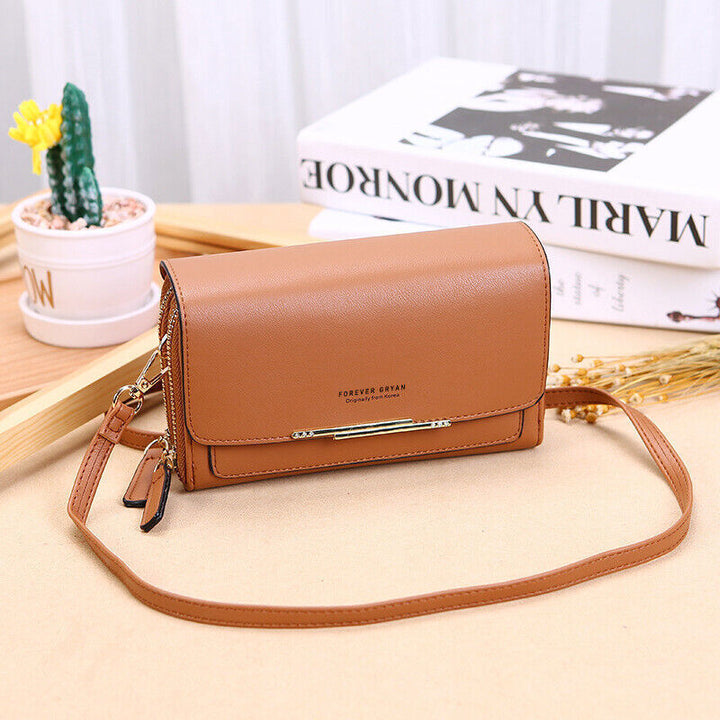Compact faux leather shoulder bag for women, featuring a multi-functional design and wallet.