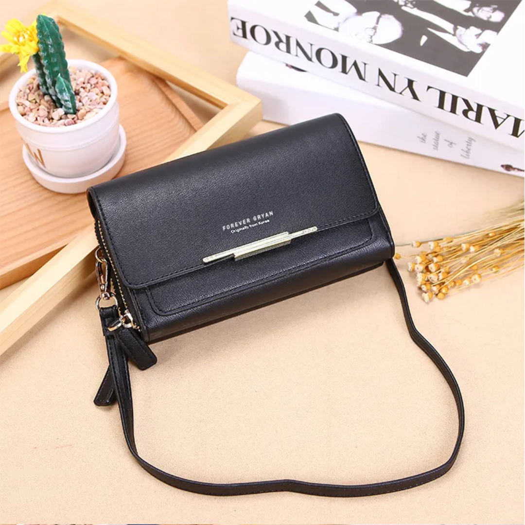 Modern women's faux leather compact bag, a versatile crossbody with a secure wallet.