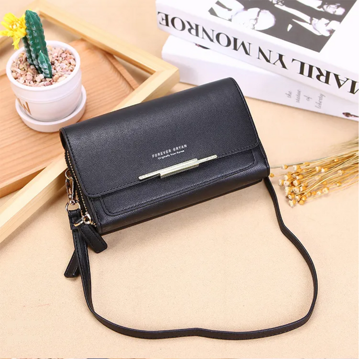 Modern women's faux leather compact bag, a versatile crossbody with a secure wallet.
