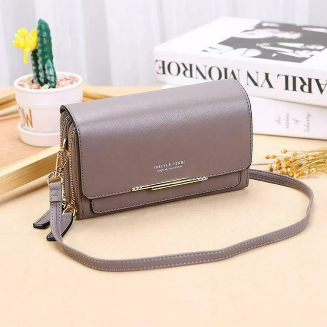 Stylish women's faux leather crossbody bag, designed for organization and convenience.