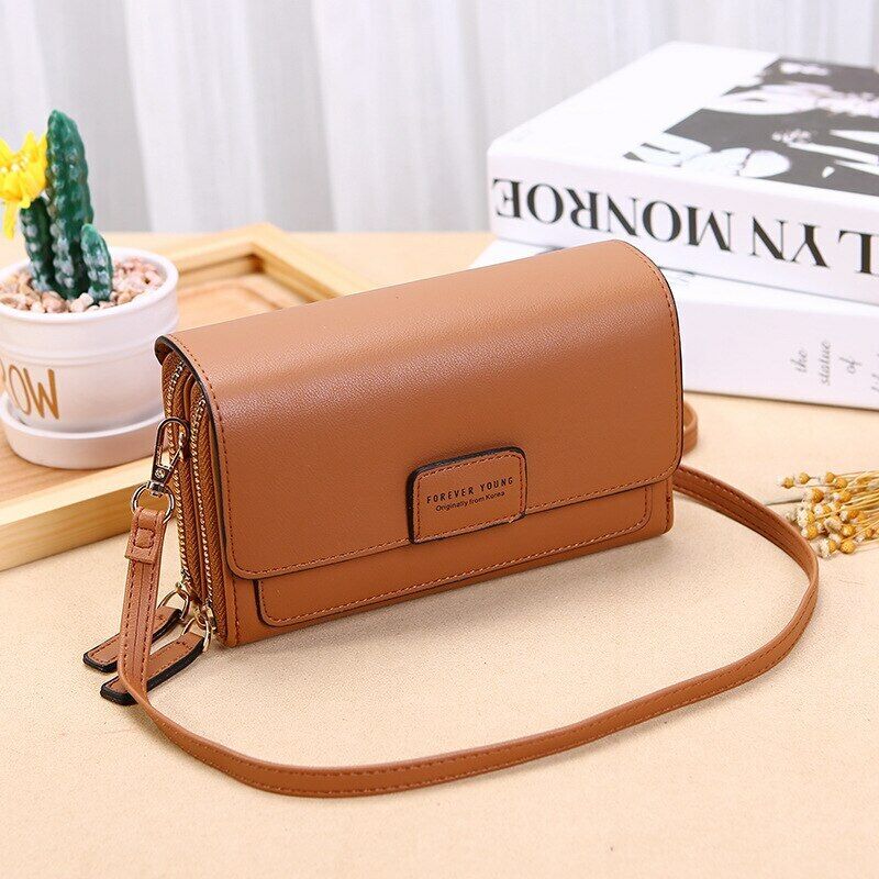 Chic faux leather crossbody bag for women, featuring a secure wallet compartment.
