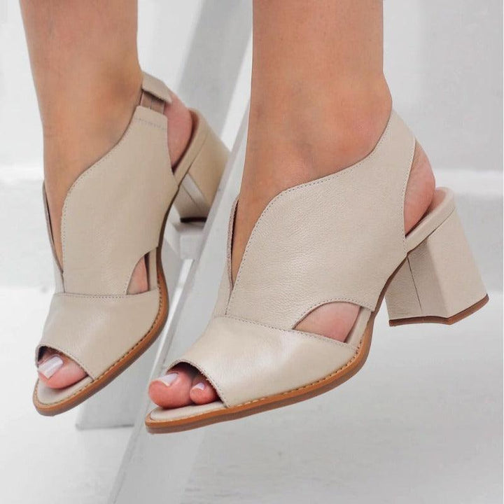 Comfortable women's heeled sandals featuring a buckle closure. Versatile & stylish footwear for events.